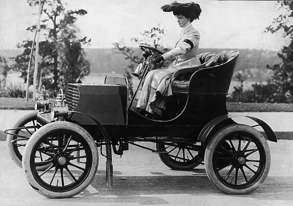 Woman Driving Early Automobile