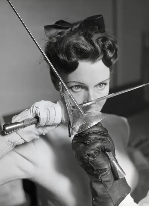 Framed Print : Woman in a Duel, Holding Foil Against Foil Framed Print : Woman in a Duel, Holding Foil Against Foil