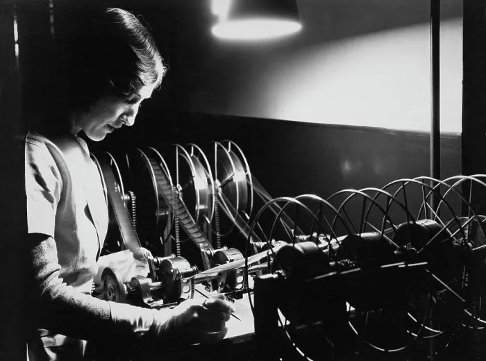 Framed Print : Woman Editing Film Framed Print : Woman Editing Film