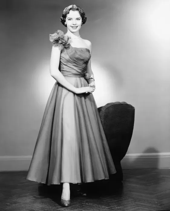 Framed Print : Woman in evening dress posing in studio (B&W), portrait Framed Print : Woman in evening dress posing in studio (B&W), portrait