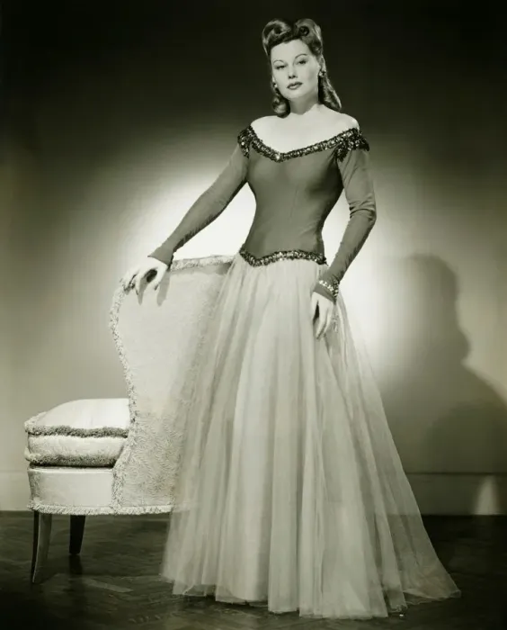 Framed Print : Woman in evening dress standing indoors, (B&W) Framed Print : Woman in evening dress standing indoors, (B&W)