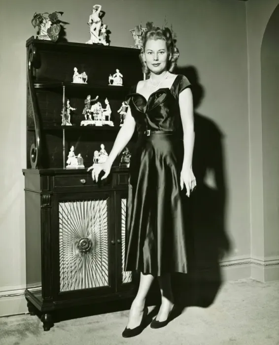 Framed Print : Woman in evening gown posing at cabinet, (B&W), (Portrait) Framed Print : Woman in evening gown posing at cabinet, (B&W), (Portrait)