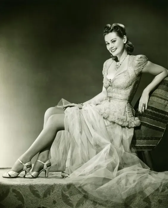 Framed Print : Woman in evening gown posing in studio, (B&W), portrait