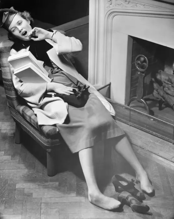 Framed Print : Woman exhausted after shopping reclining on chair, (B&W), elevated view Framed Print : Woman exhausted after shopping reclining on chair, (B&W), elevated view