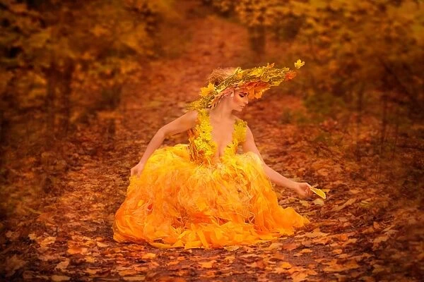 Woman in fall fashion modeling in a Fall scene