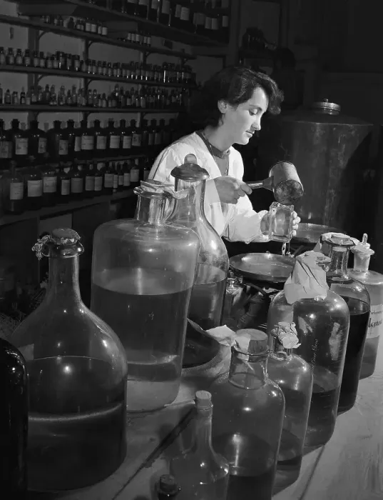Framed Print : Woman Filling Small Bottles of Perfumes Framed Print : Woman Filling Small Bottles of Perfumes