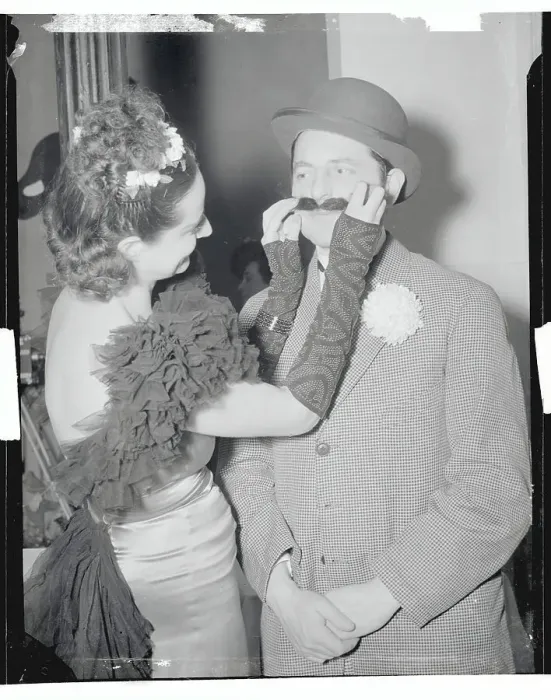 Framed Print : Woman Fixing Her Husband's Mustache Framed Print : Woman Fixing Her Husband's Mustache