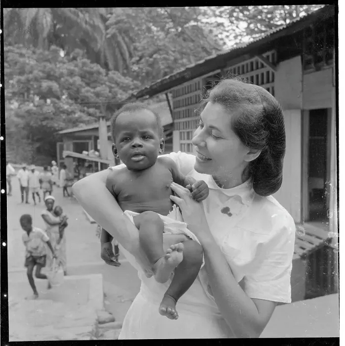 Framed Print : Woman as Foreign Caretaker Holding Child Framed Print : Woman as Foreign Caretaker Holding Child