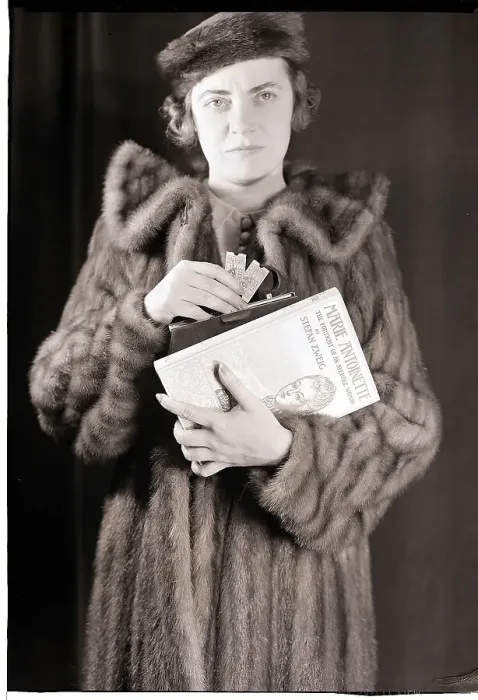 Framed Print : Woman in Fur Coat Holding Tickets Framed Print : Woman in Fur Coat Holding Tickets