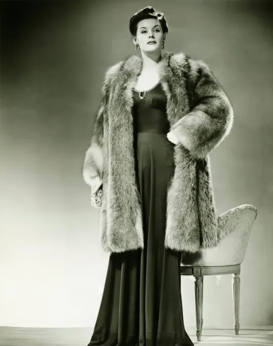 Framed Print : Woman in fur coat posing in studio, (B&W), portrait Framed Print : Woman in fur coat posing in studio, (B&W), portrait