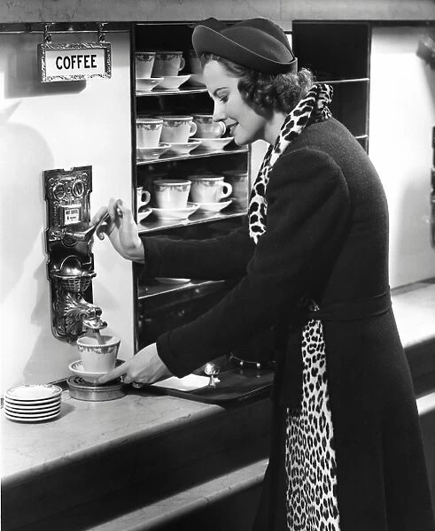 Woman getting coffee at old fashioned machine