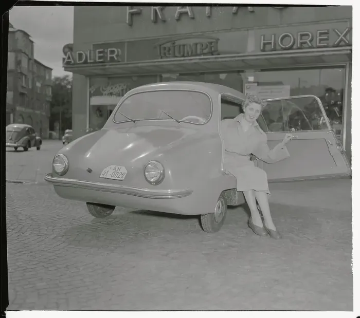 Framed Print : A Woman Getting out of New Fulda-Mobil Framed Print : A Woman Getting out of New Fulda-Mobil