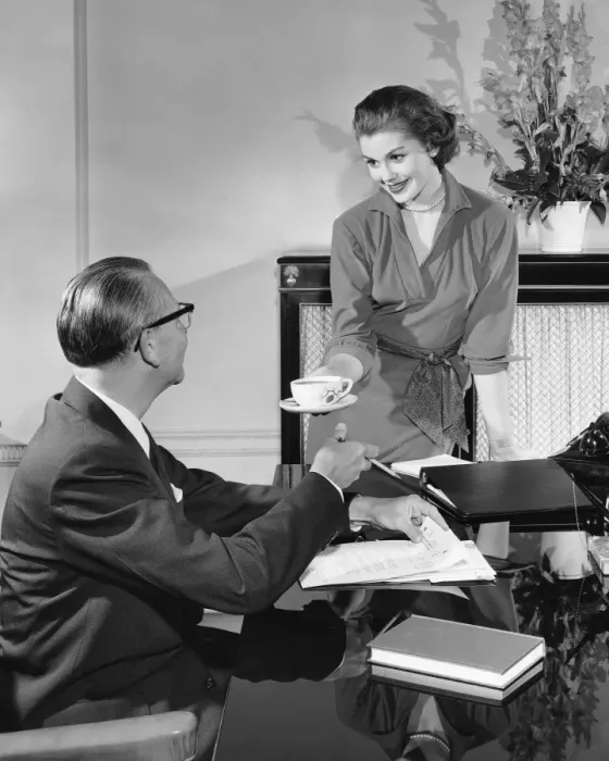 Framed Print : Woman giving cup to man Framed Print : Woman giving cup to man