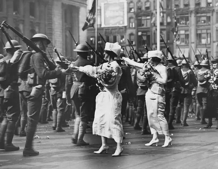 Framed Print : Woman Giving Flowers to Soldiers