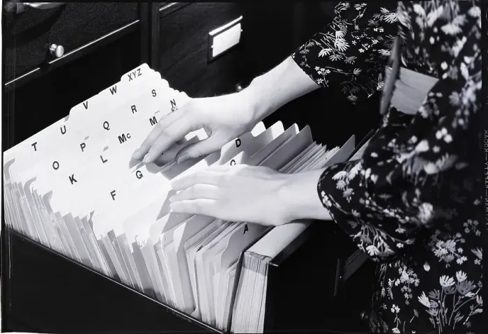 Framed Print : Woman Going Through Files Framed Print : Woman Going Through Files