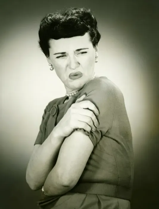 Framed Print : Woman grimacing, arms folded, (B&W), portrait Framed Print : Woman grimacing, arms folded, (B&W), portrait