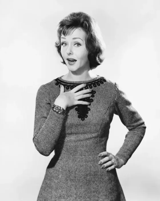 Framed Print : Woman with one hand on chest, other on hip, looking surprised Framed Print : Woman with one hand on chest, other on hip, looking surprised