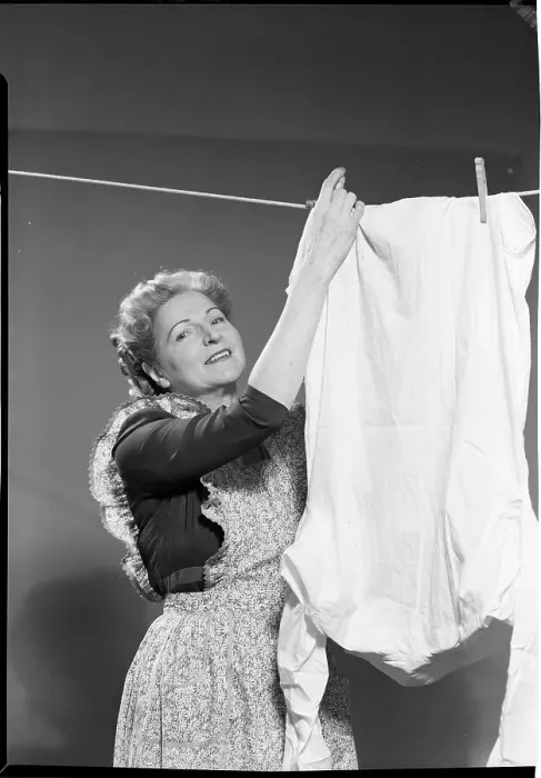 Framed Print : Woman Hanging Laundry Framed Print : Woman Hanging Laundry