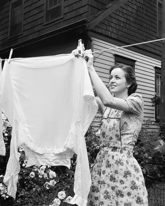 Framed Print : Woman Hanging Laundry Out to Dry Framed Print : Woman Hanging Laundry Out to Dry