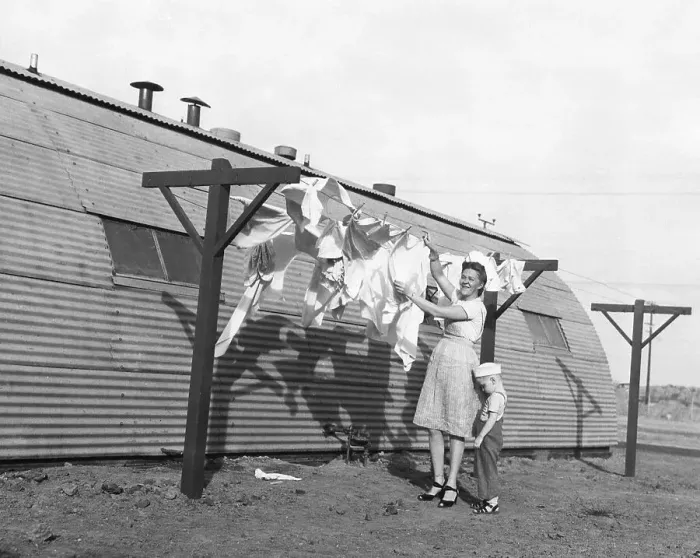 Framed Print : Woman Hangs Laundry On Line, Boy Hides Framed Print : Woman Hangs Laundry On Line, Boy Hides