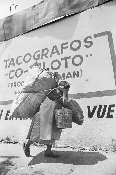 Framed Print : Woman Hauls Trash On Back & In Arms Framed Print : Woman Hauls Trash On Back & In Arms