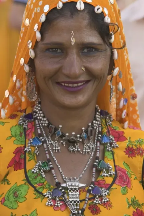 Framed Print : Woman in headscarf and jewelry smiling, close-up, portrait Framed Print : Woman in headscarf and jewelry smiling, close-up, portrait