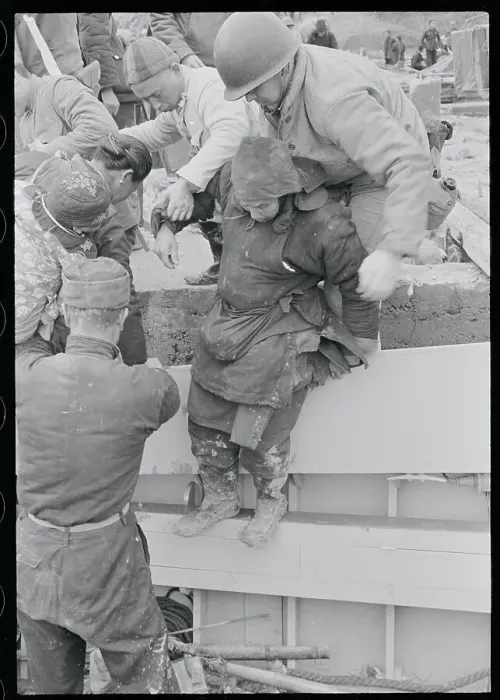 Framed Print : Woman Being Helped Onto Craft Framed Print : Woman Being Helped Onto Craft