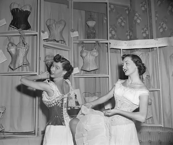 Woman Helps Other Woman Lace Corset, 1950 Print. Art Prints