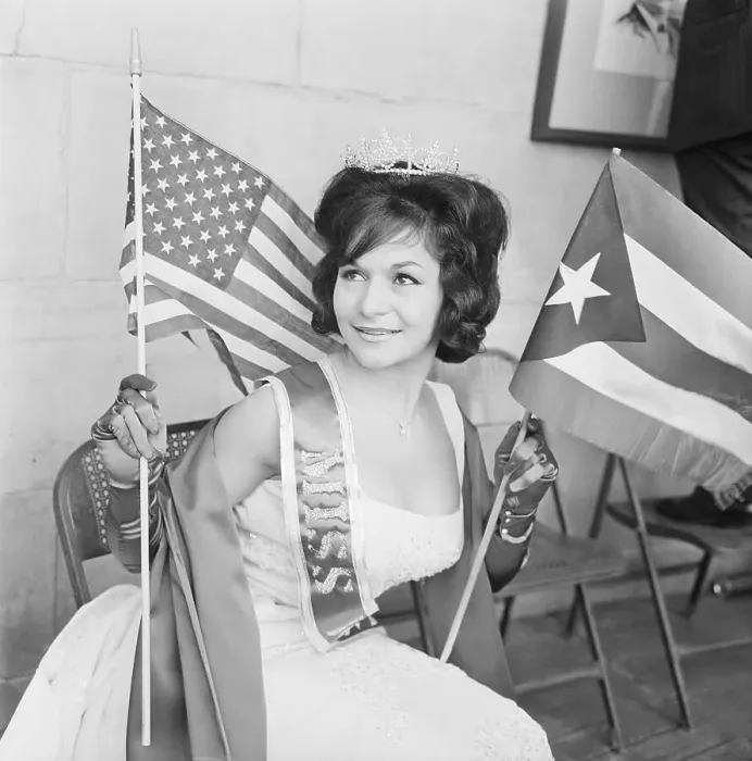 Framed Print : Woman Holding American and Puerto Rican Flags Framed Print : Woman Holding American and Puerto Rican Flags
