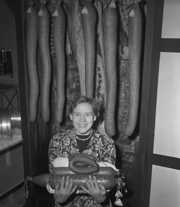 Framed Print : Woman Holding Assortment of Sausage Meats Framed Print : Woman Holding Assortment of Sausage Meats