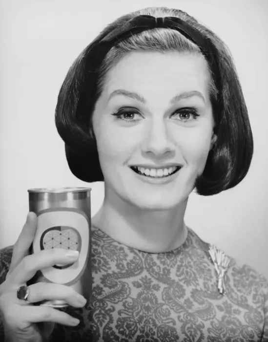 Framed Print : Woman holding up can of beer Framed Print : Woman holding up can of beer