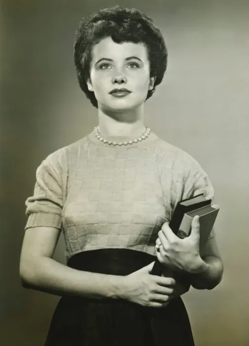 Framed Print : Woman holding books, posing in studio, (Portrait), (B&W)