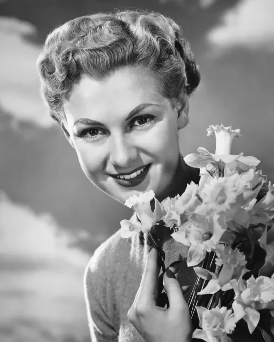 Framed Print : Woman holding bunch of daffodils Framed Print : Woman holding bunch of daffodils