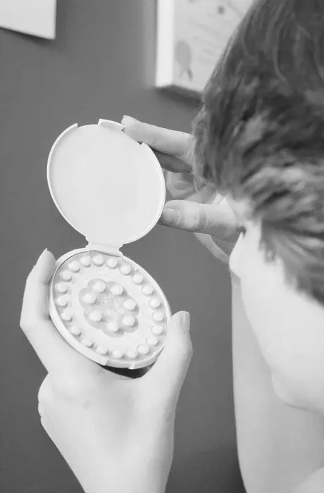 Framed Print : Woman Holding Case of Contraceptive Birth Control Pills Framed Print : Woman Holding Case of Contraceptive Birth Control Pills