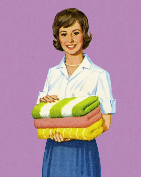 Framed Print : Woman Holding Folded Towels Framed Print : Woman Holding Folded Towels