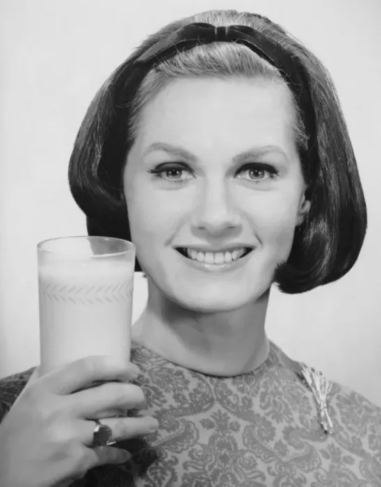 Framed Print : Woman holding glass of milk Framed Print : Woman holding glass of milk