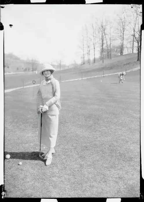 Framed Print : Woman Holding a Golf Club Framed Print : Woman Holding a Golf Club