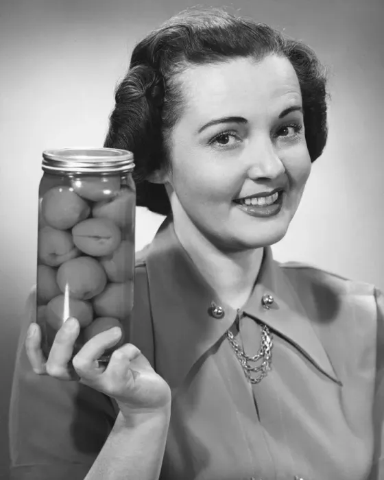 Framed Print : Woman holding jar of fruit Framed Print : Woman holding jar of fruit