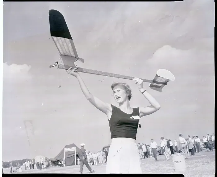 Framed Print : Woman Holding a Model Plane Framed Print : Woman Holding a Model Plane
