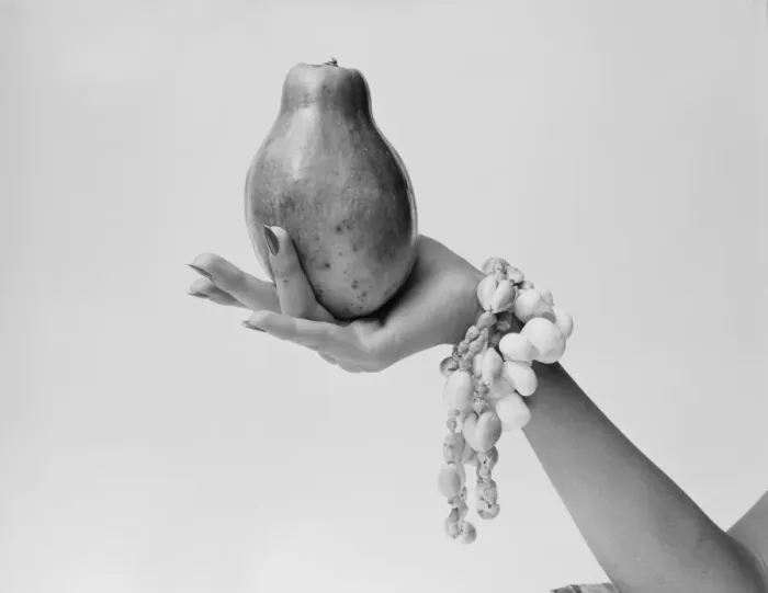 Framed Print : Woman holding papaya, close-up