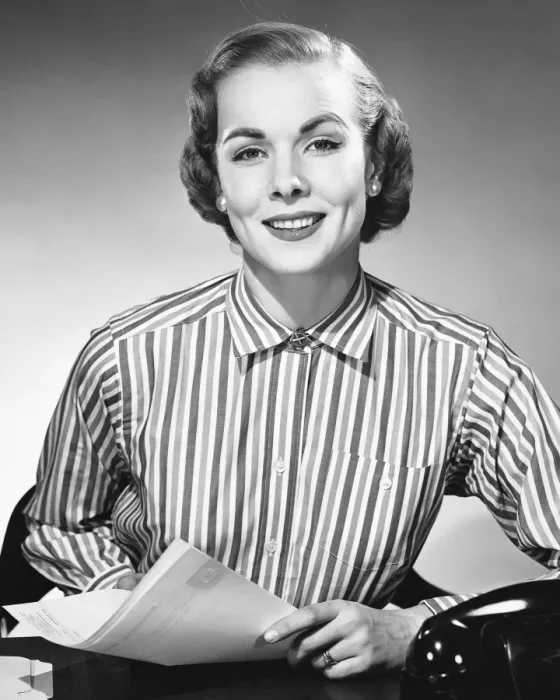 Framed Print : Woman holding paper, posing and smiling Framed Print : Woman holding paper, posing and smiling