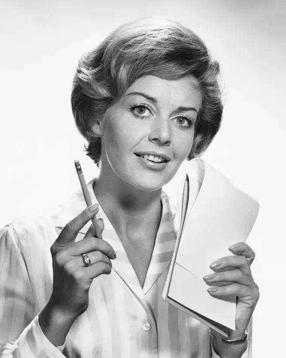Framed Print : Woman holding pencil and paper