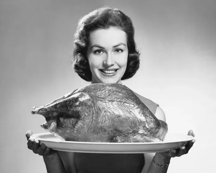 Framed Print : Woman holding platter with roast turkey Framed Print : Woman holding platter with roast turkey