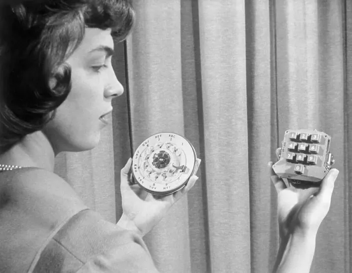 Framed Print : Woman Holding Pushbutton and Rotary Dialers