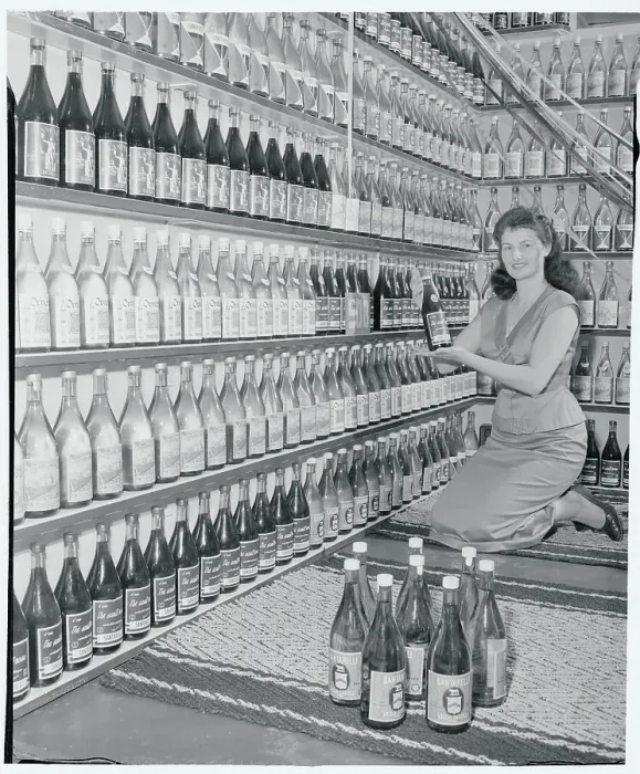 Framed Print : Woman Holding a Wine Bottle Framed Print : Woman Holding a Wine Bottle