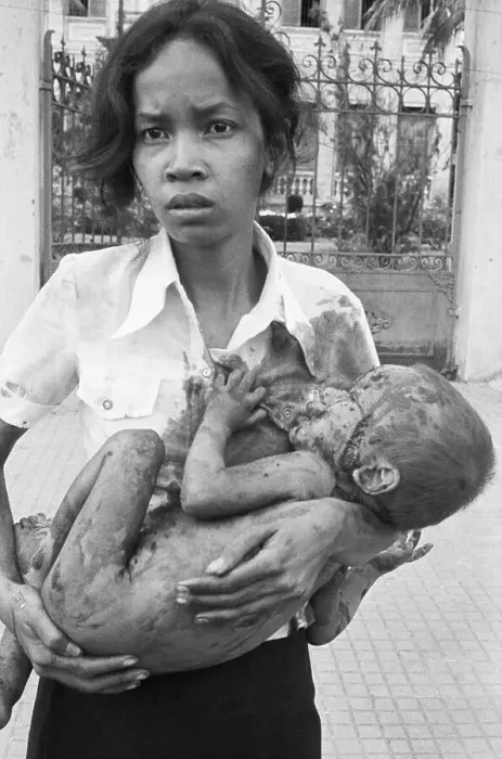 Framed Print : Woman Holds Her Wounded Child Framed Print : Woman Holds Her Wounded Child