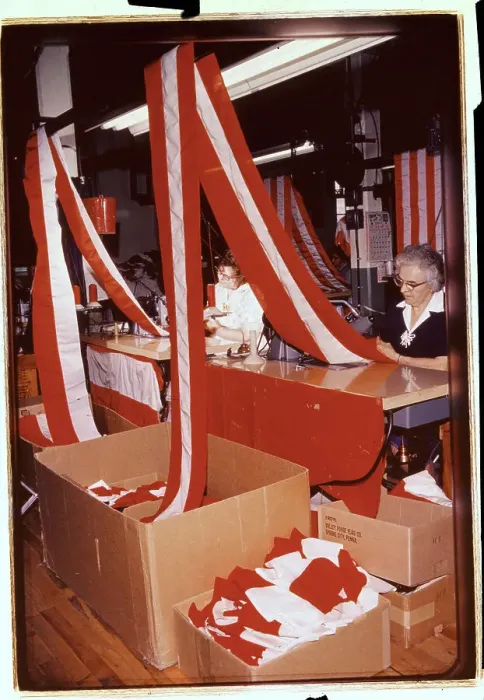Framed Print : Woman Joining Red and White Stripes of Cloth Framed Print : Woman Joining Red and White Stripes of Cloth