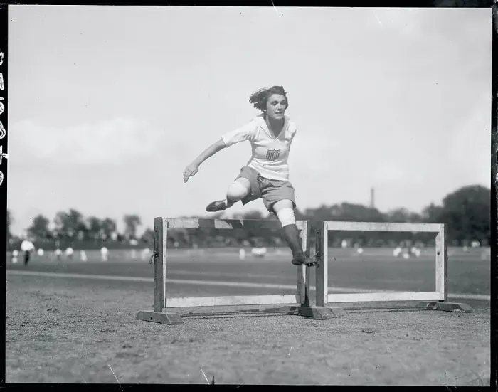Framed Print : Woman Jumping Hurdle Framed Print : Woman Jumping Hurdle