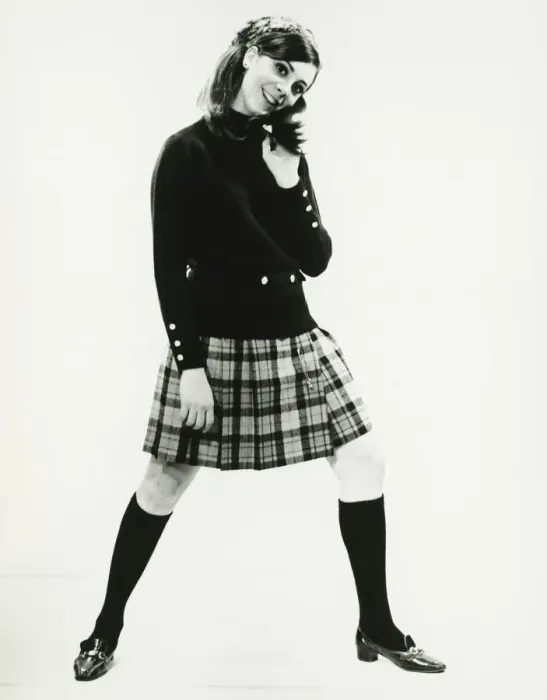 Framed Print : Woman in kilt posing in studio, (B&W), portrait Framed Print : Woman in kilt posing in studio, (B&W), portrait