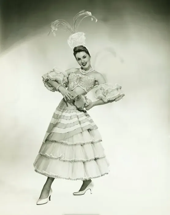 Framed Print : Woman in Latino dance costume posing in studio, holding drum, (B&W) Framed Print : Woman in Latino dance costume posing in studio, holding drum, (B&W)